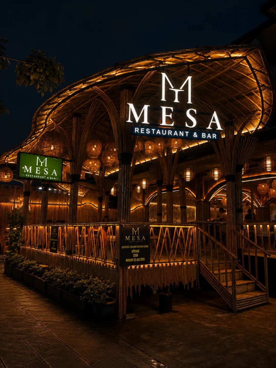 MESA Restaurant & Bar at night — illuminated bamboo architecture and warm gold signage